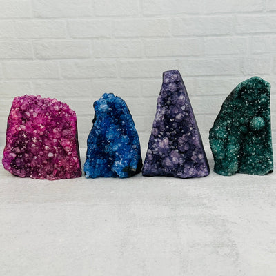 Colorful Dyed Crystal Cut Bases displayed to show the differences in the colors and sizes 