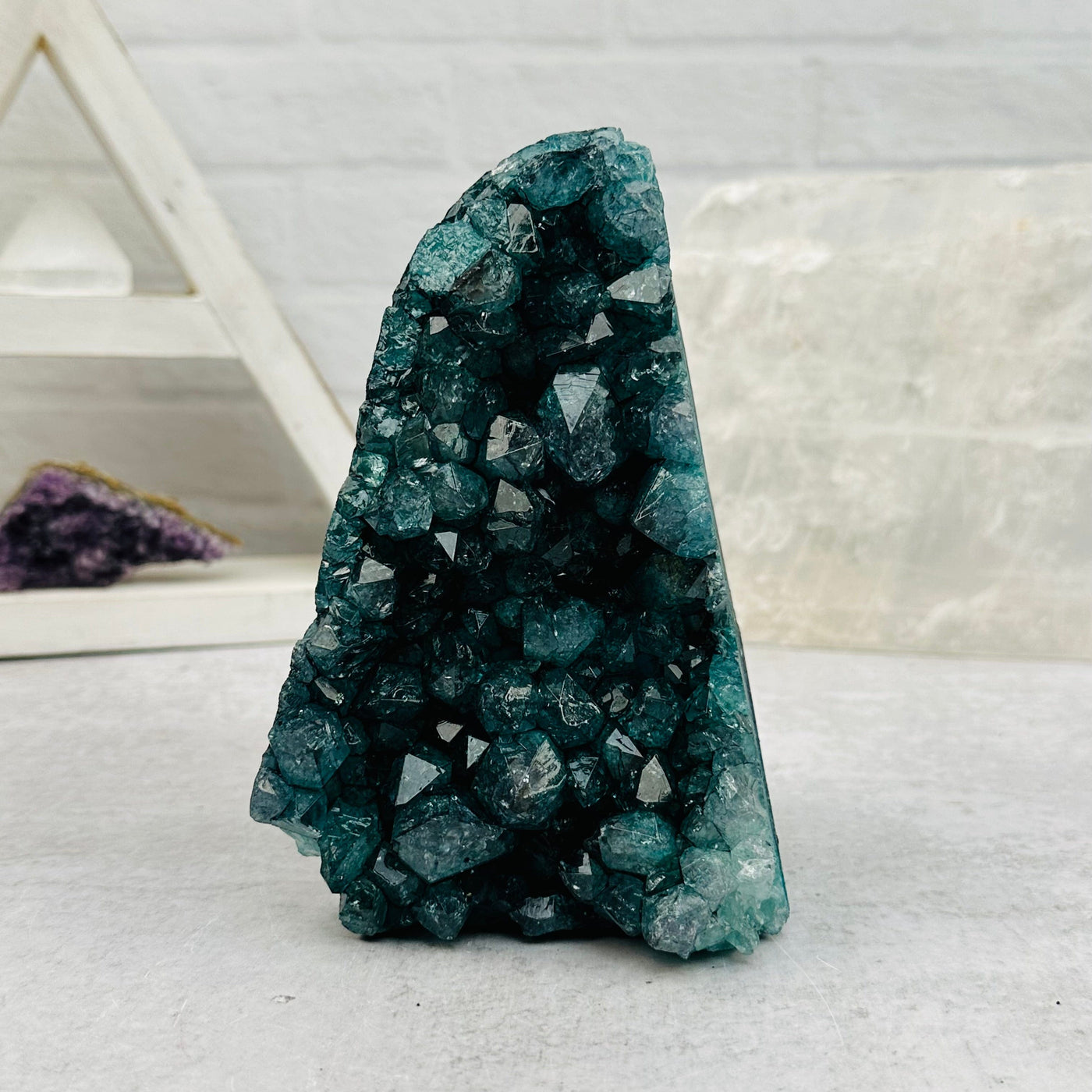 dyed green Amethyst Crystal Cluster CutBase displayed as home decor 