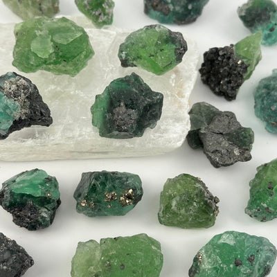 multiple crystal clusters displayed to show the differences in the sizes and color shades 