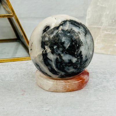 Fire Quartz Sphere Stand displayed as home decor 