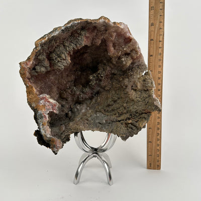 Natural Calcite Crystal Formation on Stand displayed next to a ruler for size reference 