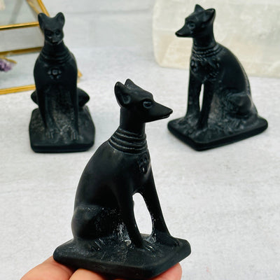 Black Obsidian Dog - Sophisticated Canine in hand for size reference 