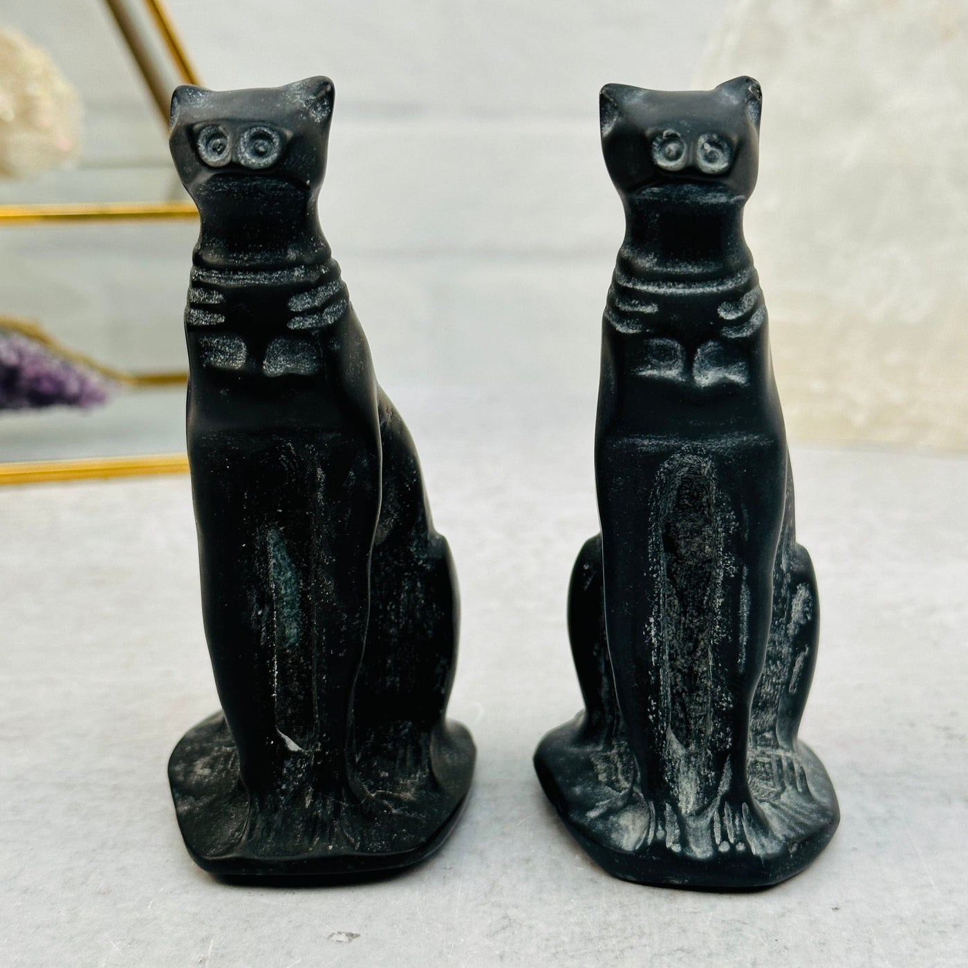 front view of the hand carved cats 
