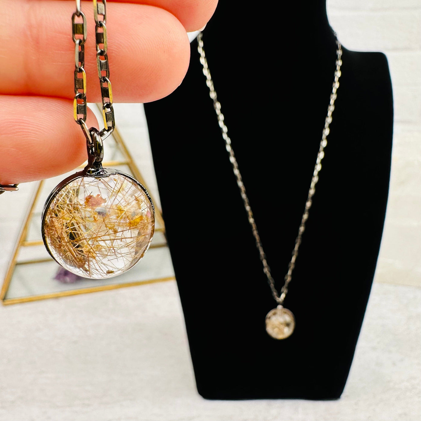 close up of this Gold Rutilated Quartz Sphere Necklace