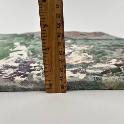  Large Rainbow Fluorite Free Formed Crystal Slab displayed next to a ruler for size reference 