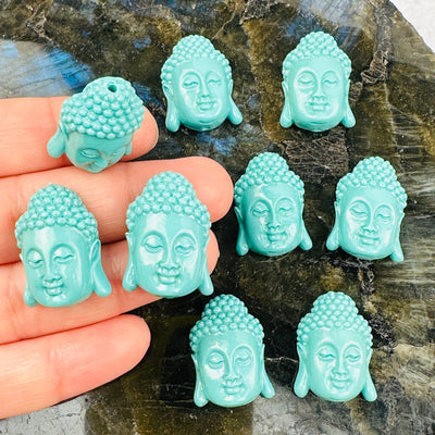 Turquoise Magnesite Buddha Beads  with a hand for size reference