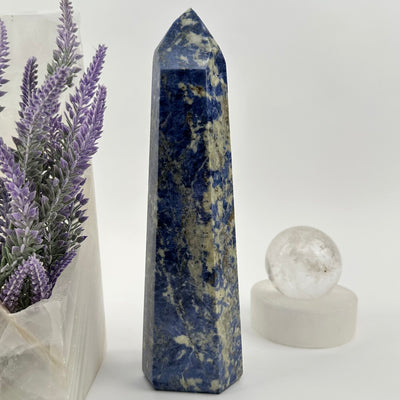  Sodalite Polished Crystal Point displayed as home decor