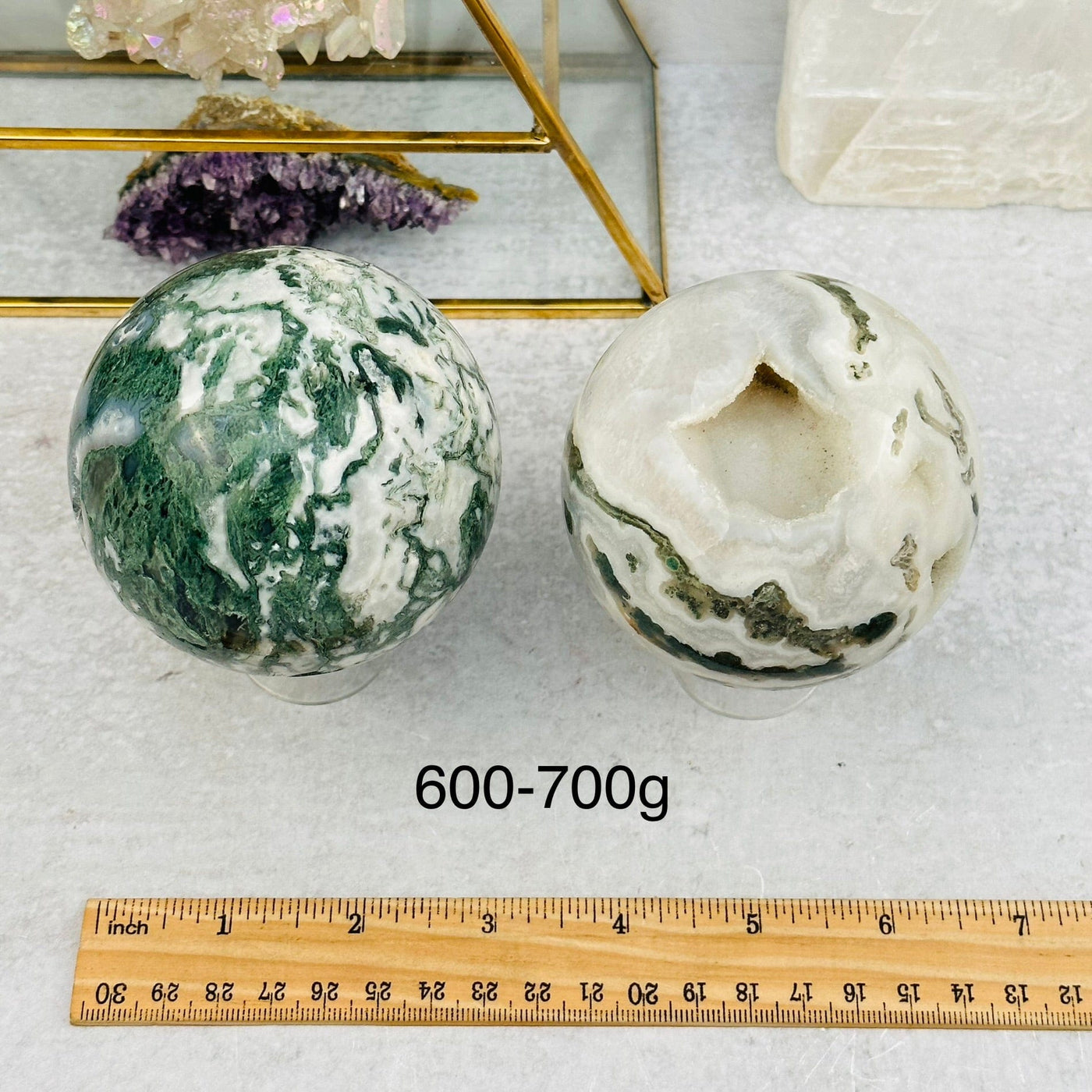 Moss Agate Spheres - By Weight - next to a ruler for size reference
