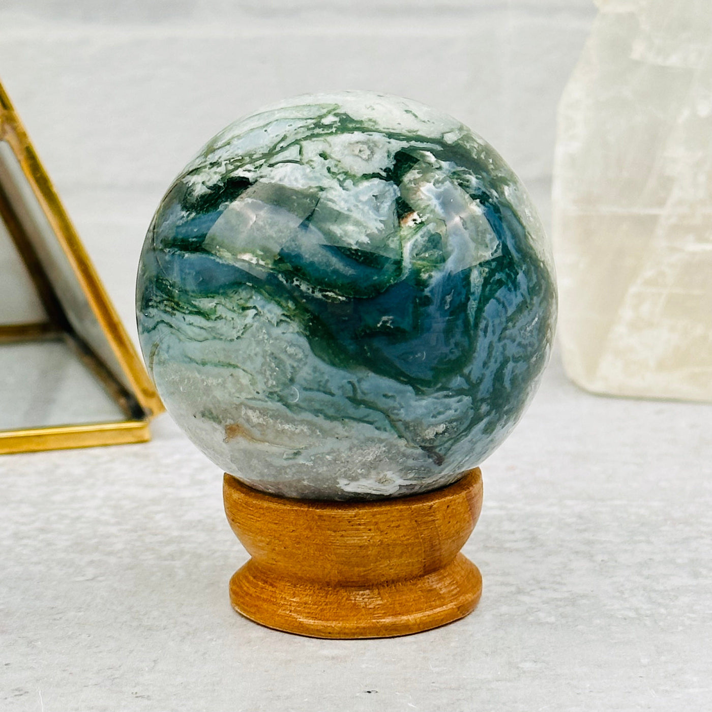 Moss Agate Sphere displayed as home decor 
