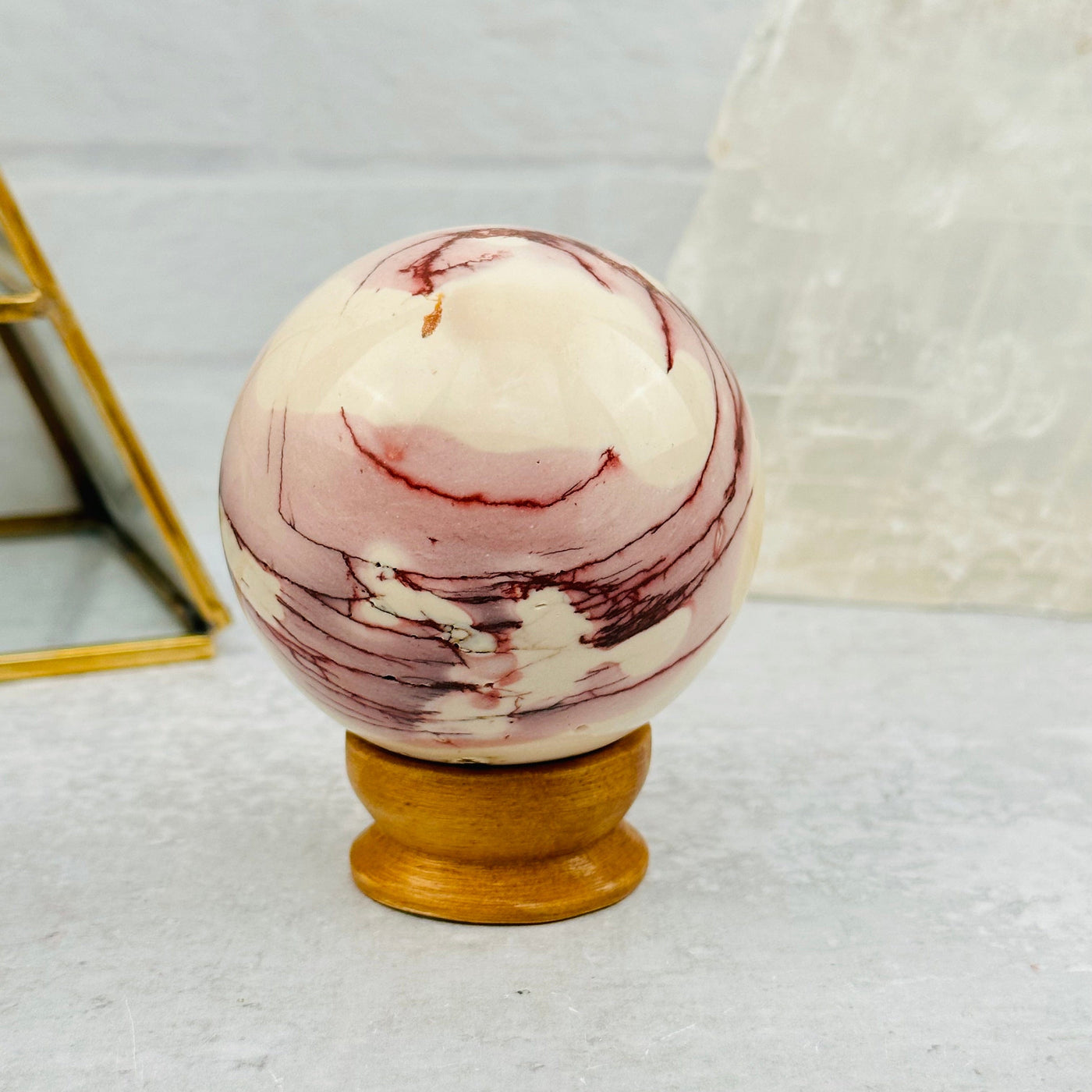 Mookaite Polished Sphere displayed as home decor