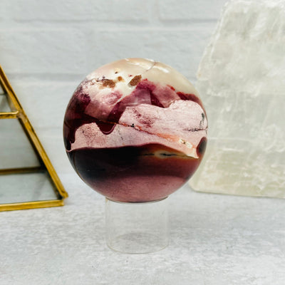 Mookaite Polished Sphere displayed as home decor 