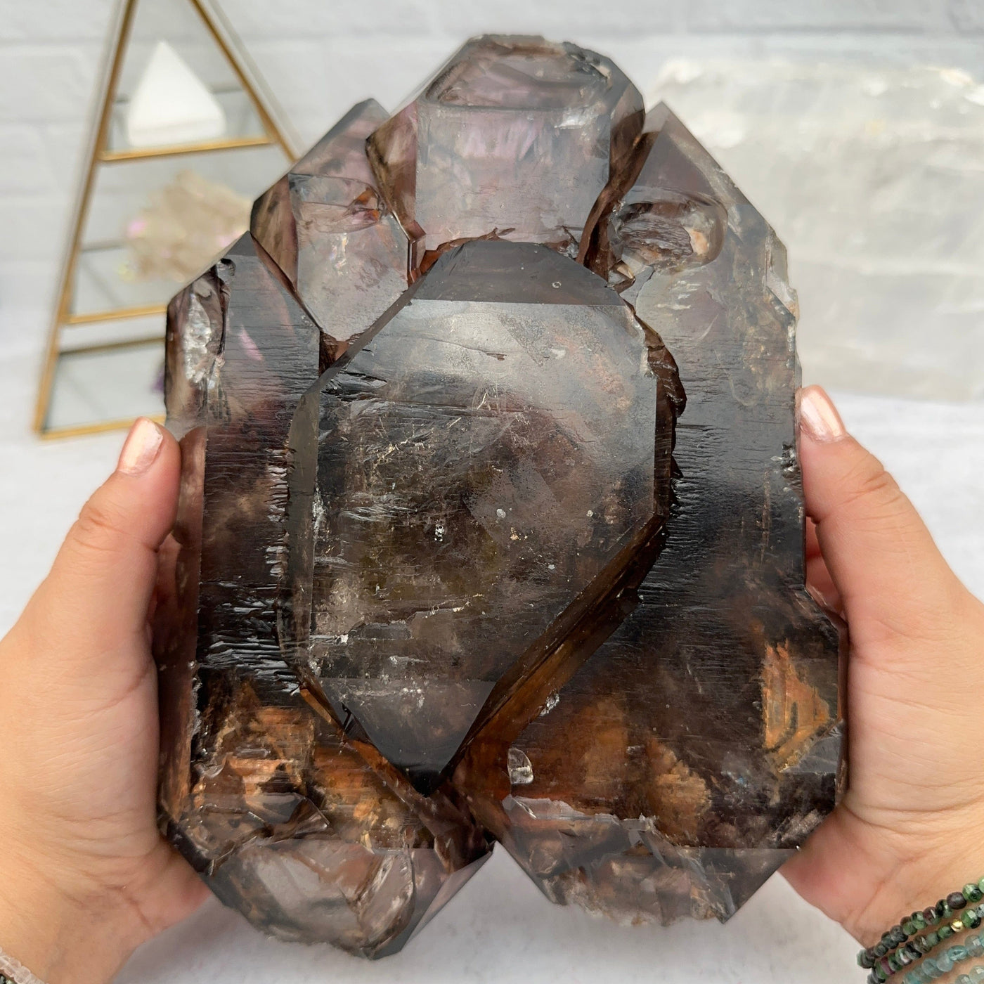 Elestial Alligator Smokey Quartz Crystal in hands for size reference 