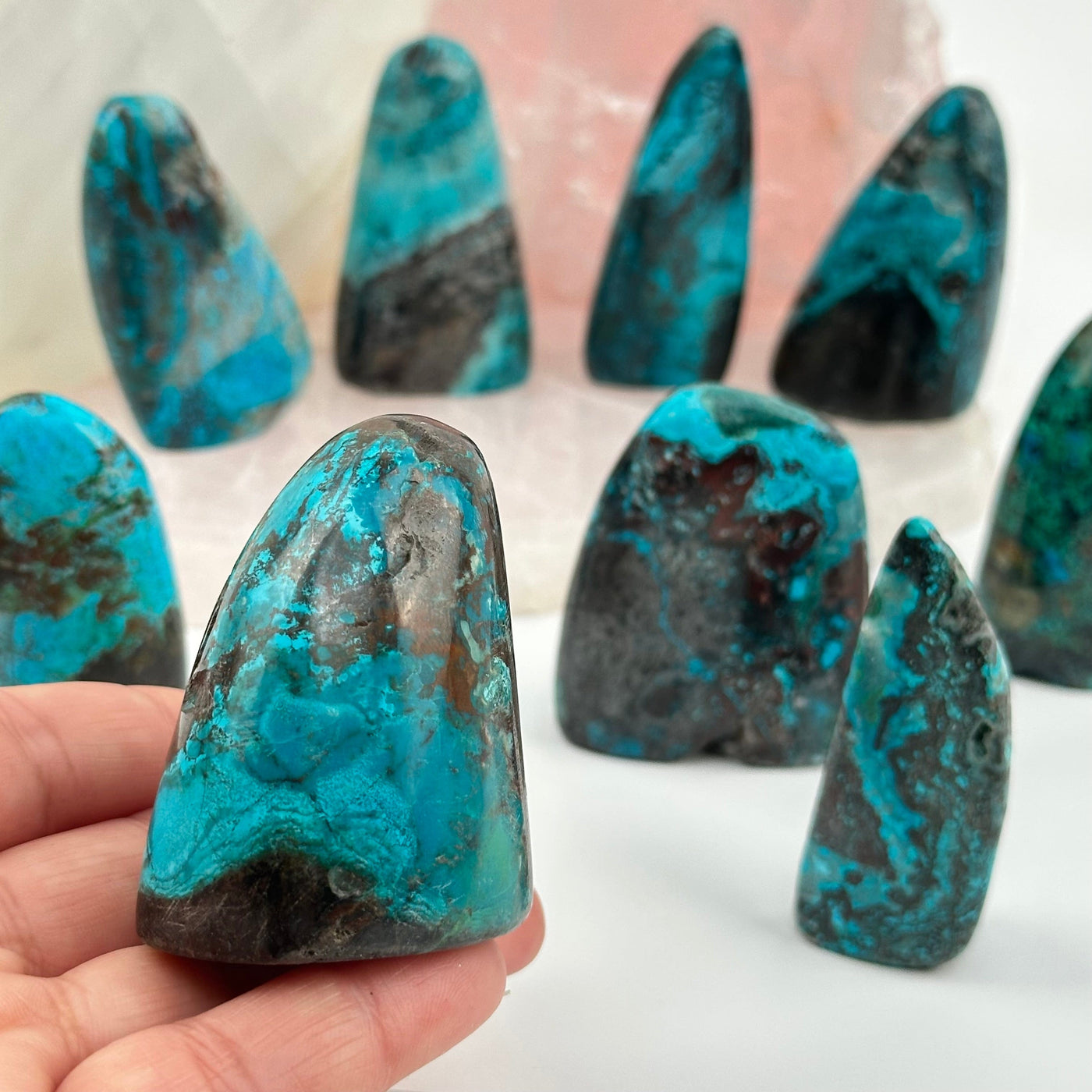 Chrysocolla Crystal Cut Base from Peru in hand for size reference 