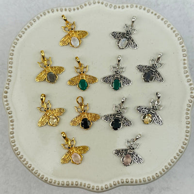 crystal bee pendants with decorations in the background