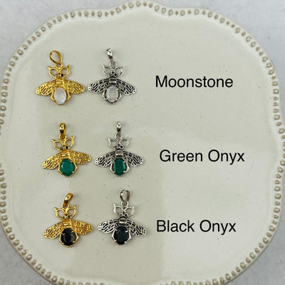 crystal bee pendants with decorations in the background