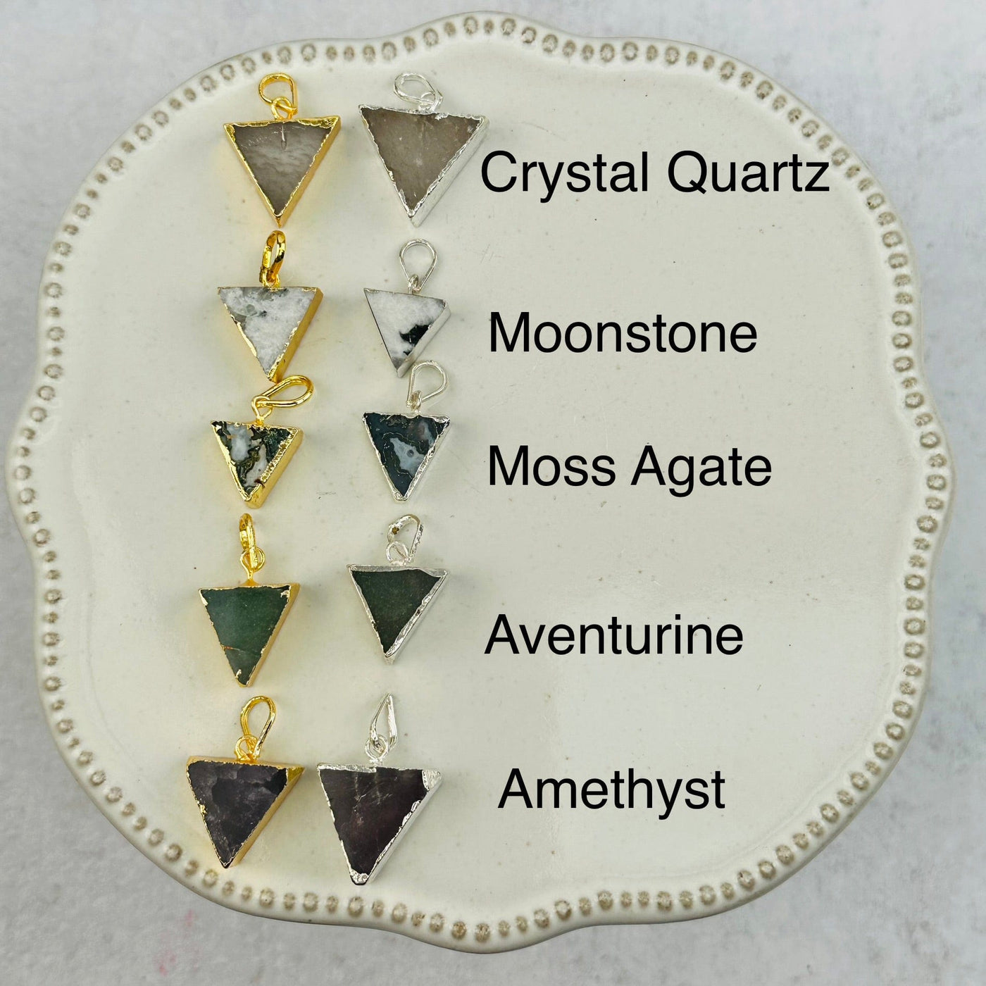 Gemstone Triangle Pendants next to their crystal name 