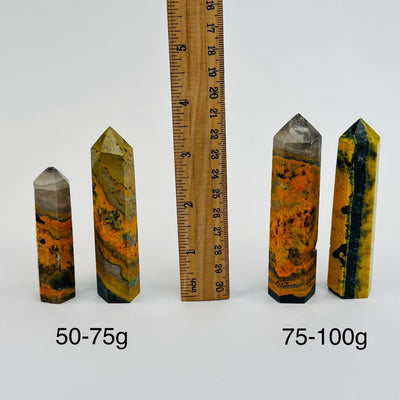 Bumble Bee Jasper Crystal Point - By Weight - next to a ruler for size reference 