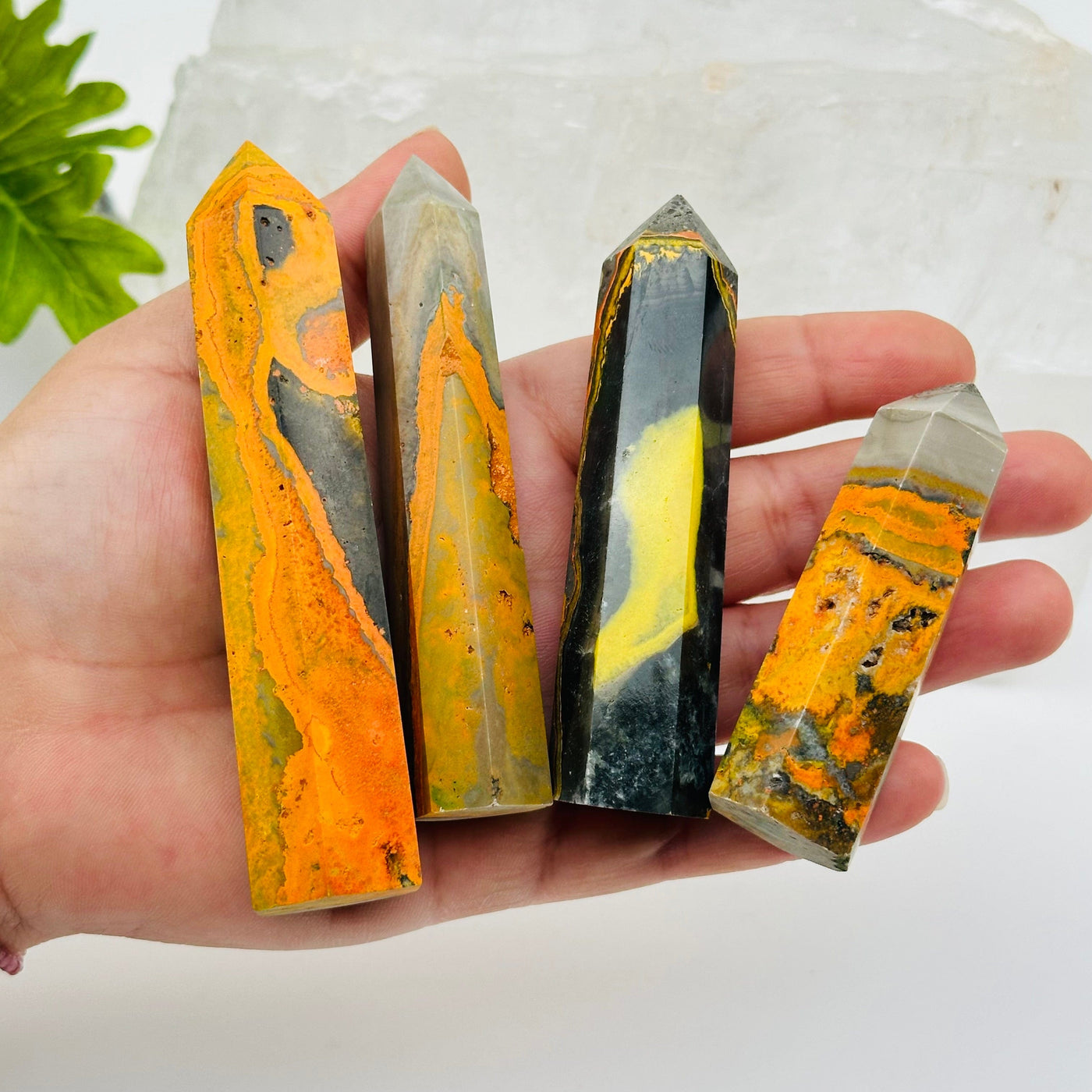 Bumble Bee Jasper Crystal Point - By Weight - in hand for size reference 