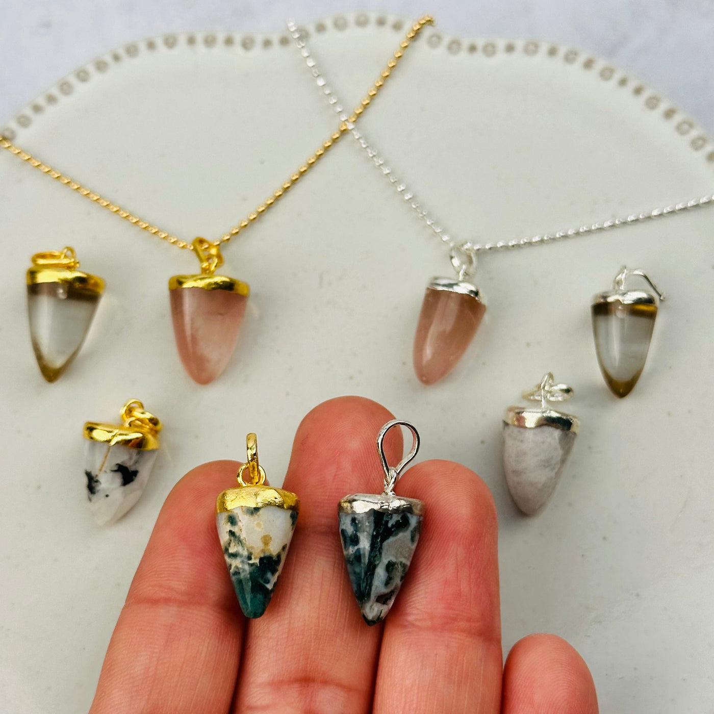 Gemstone Point Pendant with Electroplated 24k Gold or Silver Cap and Bail in hand for size reference 