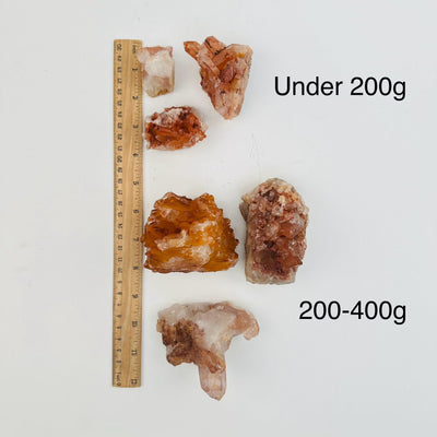 Tangerine Quartz Clusters - By Weight - next to a ruler for size reference 