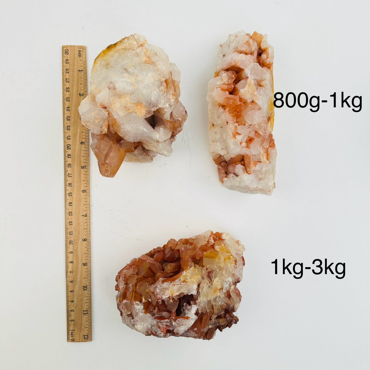 Tangerine Quartz Clusters - By Weight - next to a ruler for size reference