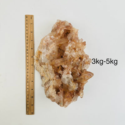 Tangerine Quartz Clusters - By Weight - next to a ruler for size reference