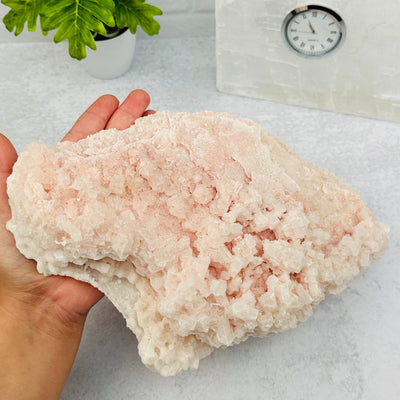Pink Halite Unique Formation from California in hand for size reference 
