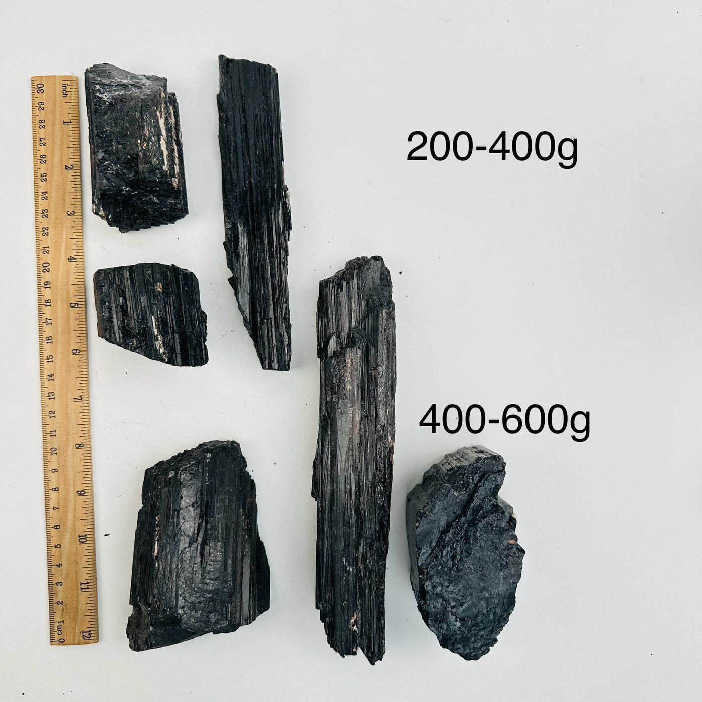 Natural Black Tourmaline - By Weight - next to a ruler for size reference