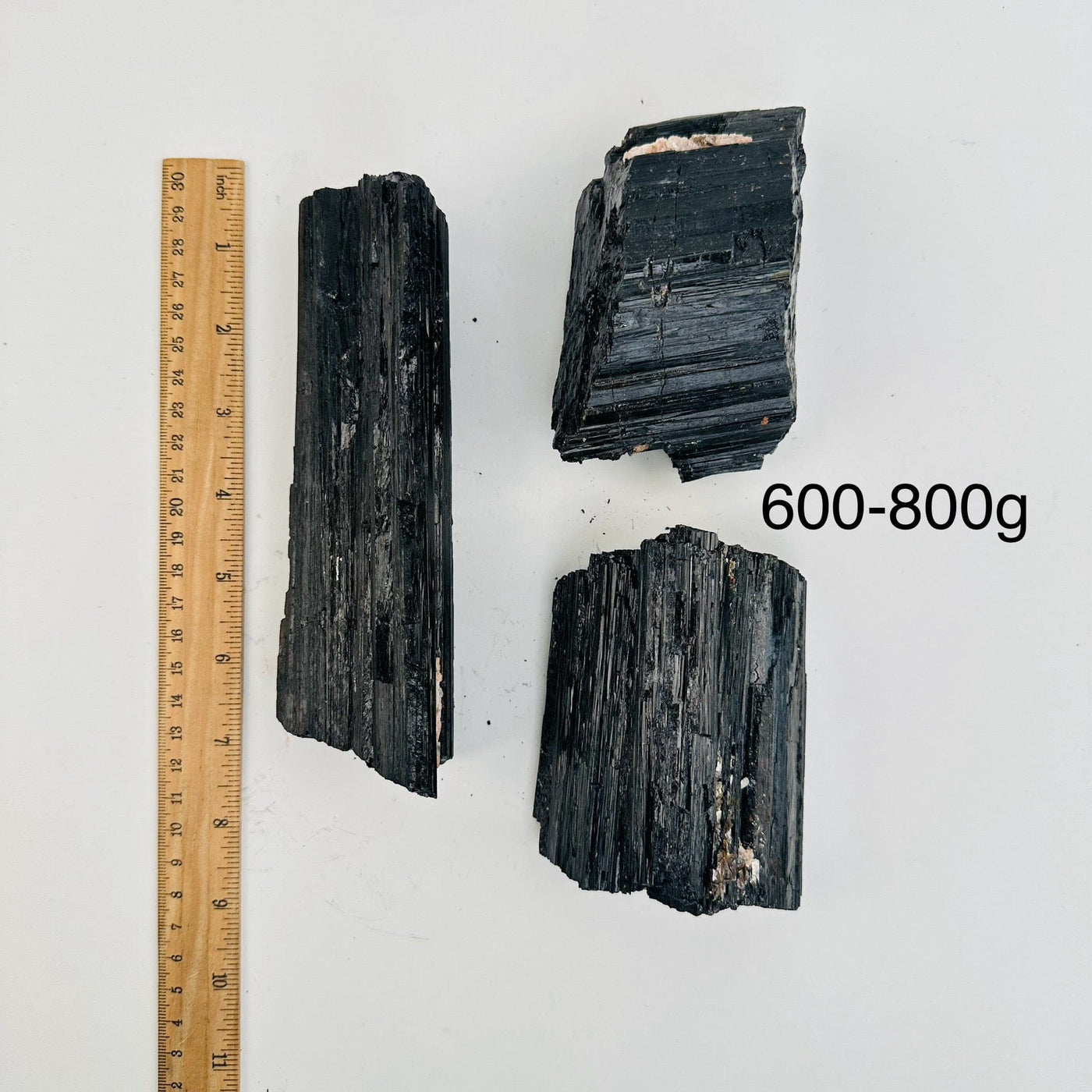 Natural Black Tourmaline - By Weight - next to a ruler for size reference