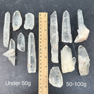 Lemurian Tangerine Quartz Crystals from Diamantina Brazil - By Weight - next to a ruler for size reference 