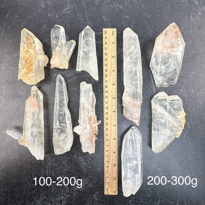 Lemurian Tangerine Quartz Crystals from Diamantina Brazil - By Weight - next to a ruler for size reference 