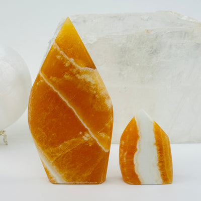 Banded Orange Calcite Crystal Points displayed as home decor 