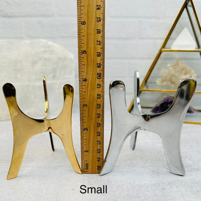 Crystal Tripod Stand next to a ruler for size reference 