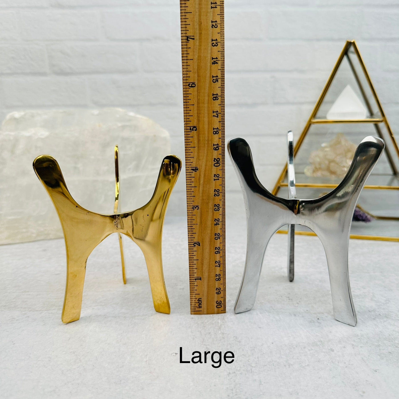 Crystal Tripod Stand next to a ruler for size reference 