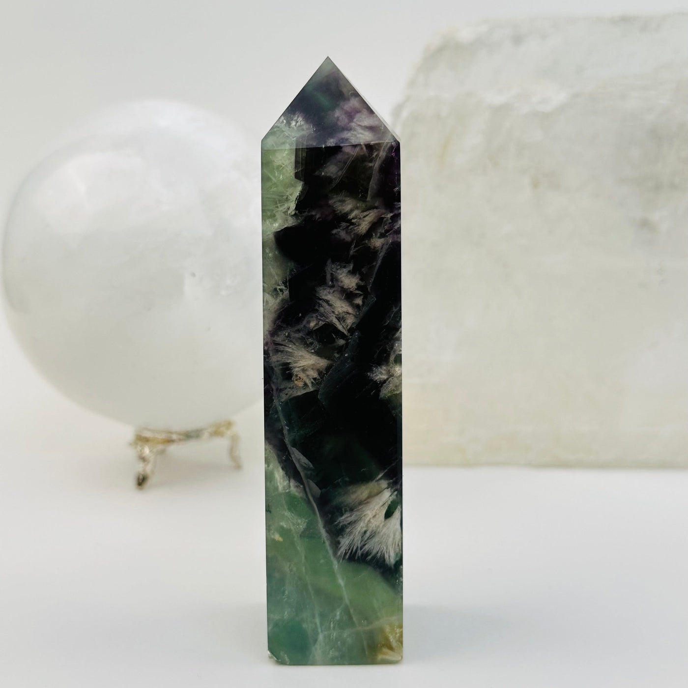 Rainbow Feathered Fluorite Crystal Polished Point Tower displayed as home decor