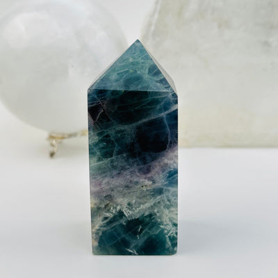 Rainbow Feathered Fluorite Crystal Polished Point Tower displayed as home decor