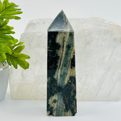 Green Sea Jasper Obelisk Crystal Point displayed as home decor 