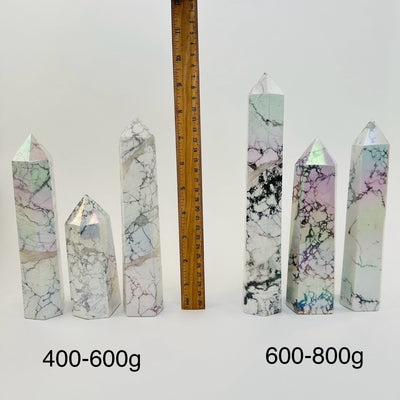 Howlite Tower Points with Angel Aura Titanium Finish - By Weight - next to a ruler for size reference 