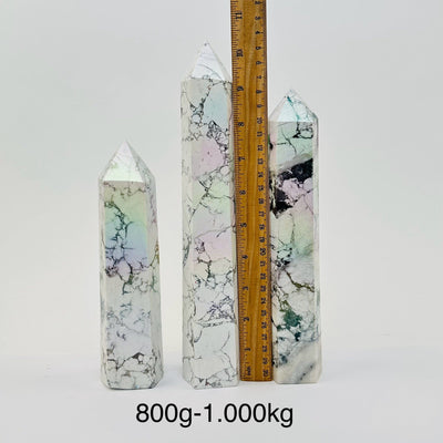 Howlite Tower Points with Angel Aura Titanium Finish - By Weight - next to a ruler for size reference 