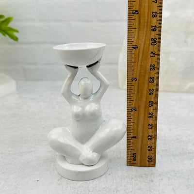 Crystal Stand - White Aluminum Yoga Goddess Figure next to a ruler for size reference 