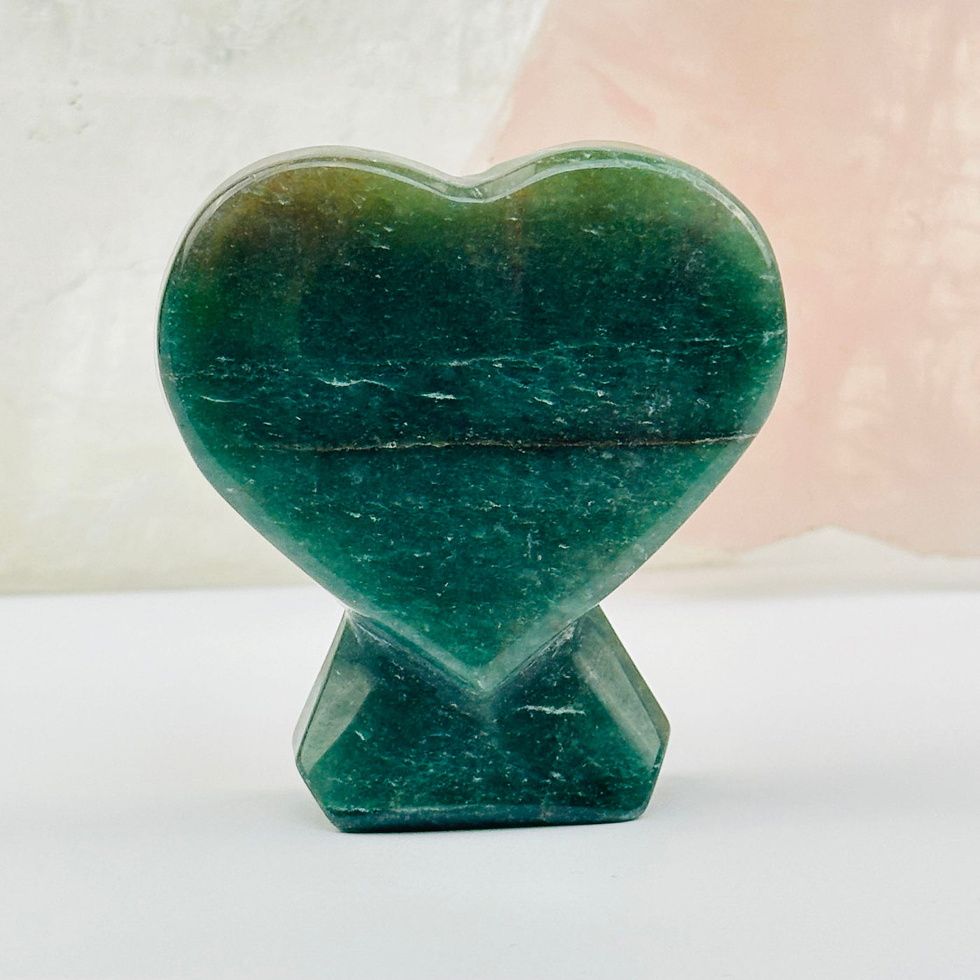 close up of the details on this green aventurine heart 