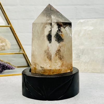 Lodolite Crystal Quartz on Wooden Stand displayed as home decor 
