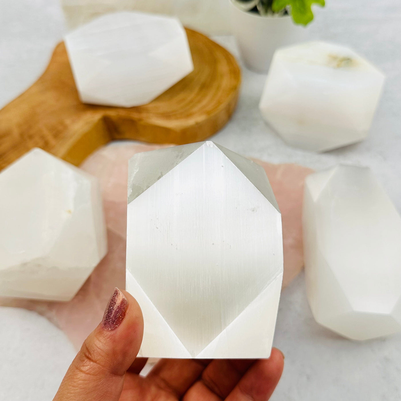 Selenite - Tumbled Polygon Shape in hand for size reference 