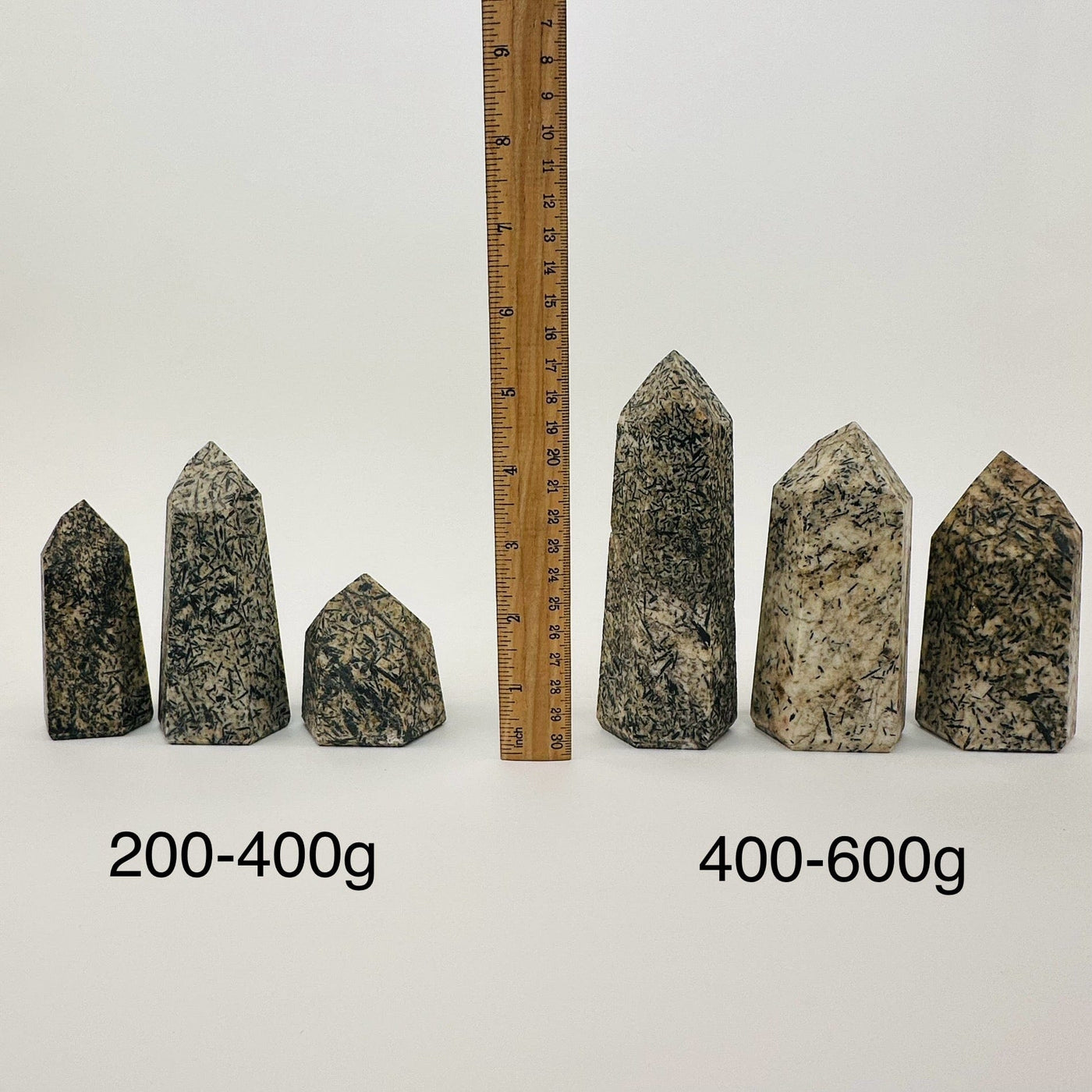 Epidote Polished Crystal Points by weight - next to a ruler for size reference 