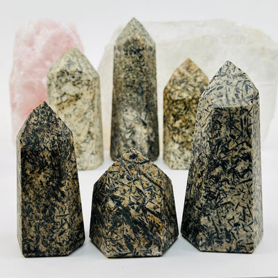 Epidote Polished Crystal Points displayed to show the differences in the sizes and color shades 