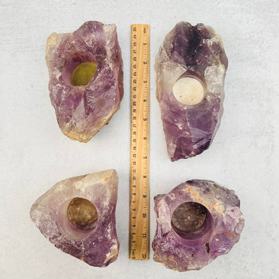 amethyst candle holders next to a ruler for size reference 