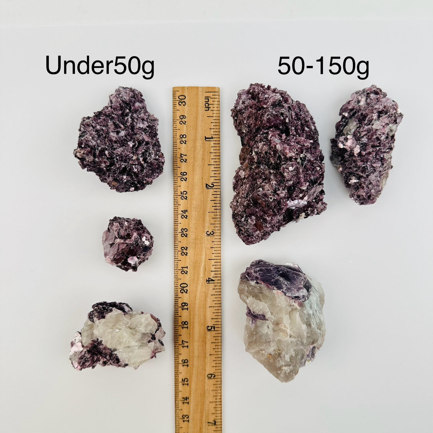 Star Mica Crystal Cluster with Lepidolite by weight next to a ruler for size reference 