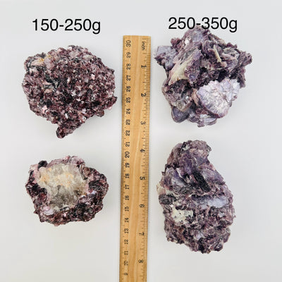 Star Mica Crystal Cluster with Lepidolite by weight next to a ruler for size reference