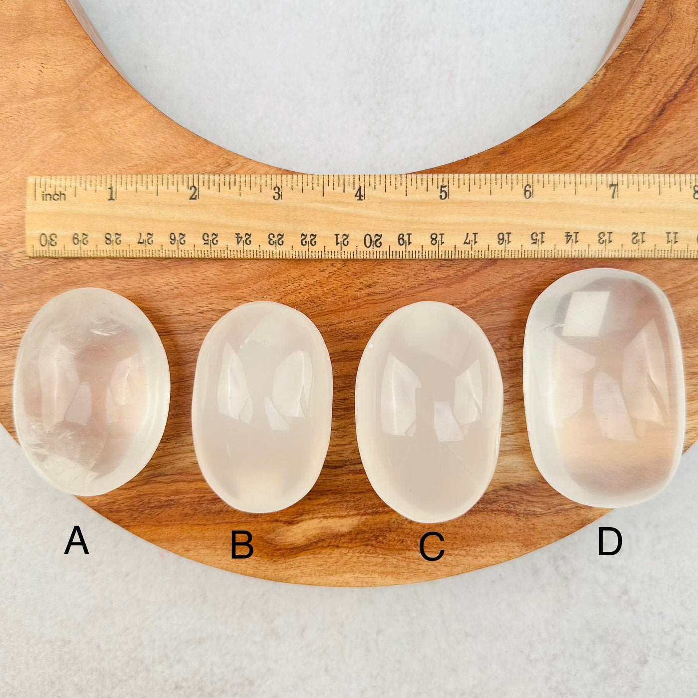 Crystal Quartz Palm Stones - High Quality - next to a ruler for size reference 