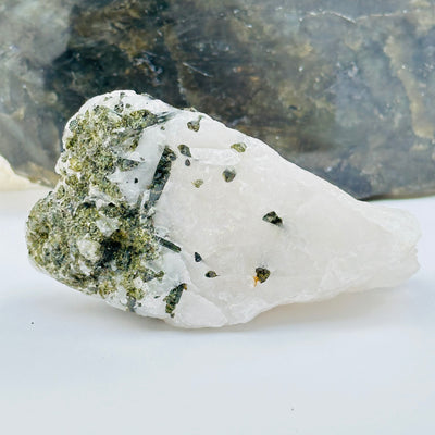 Green Tourmaline Rough Crystal on Matrix displayed as home decor 